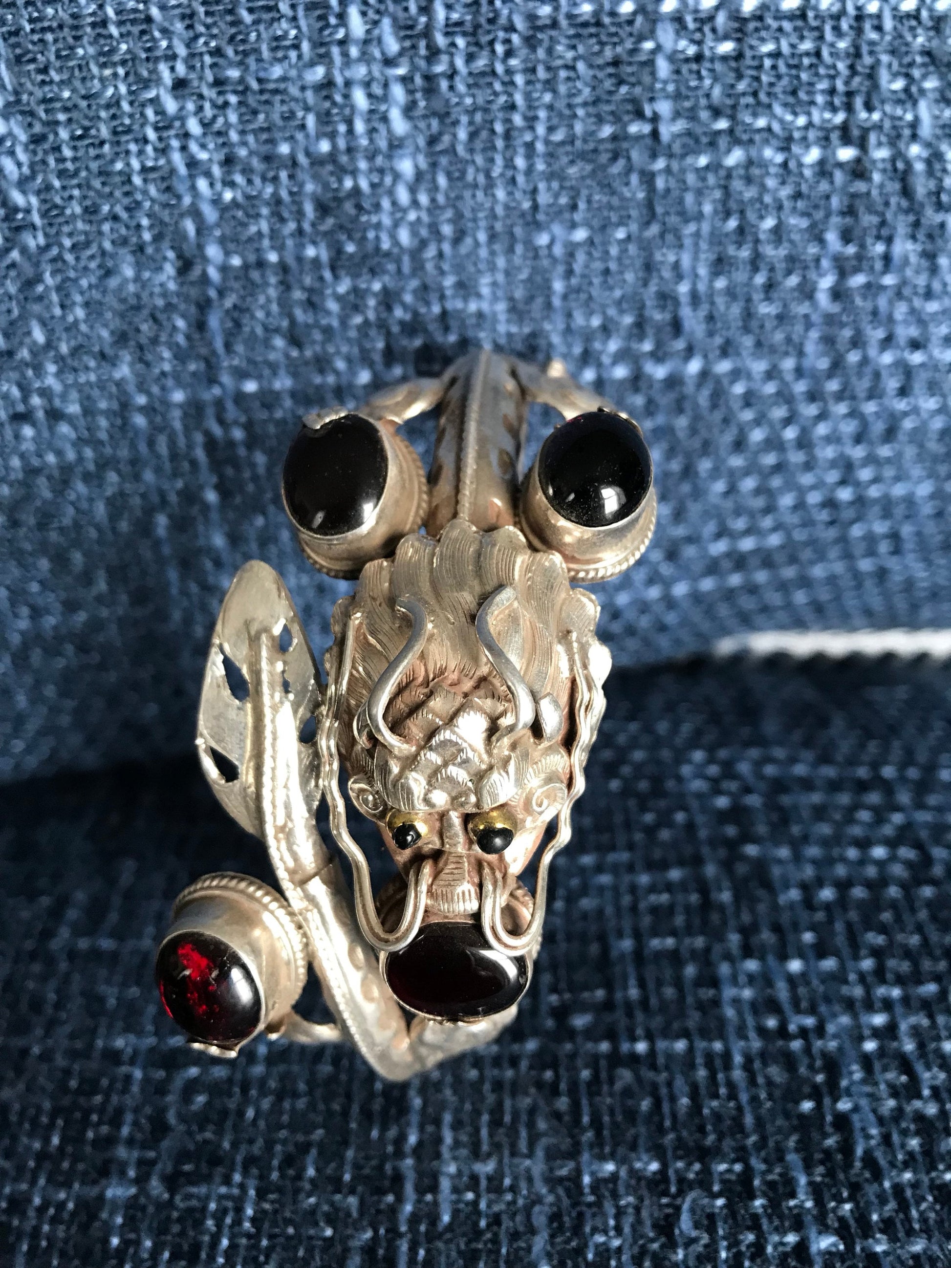 Sterling silver Dragon cuff bracelet, Handmade in Nepal, Dragon holding Garnet stone in his claws and mouth. wealth/good fortune/heroism