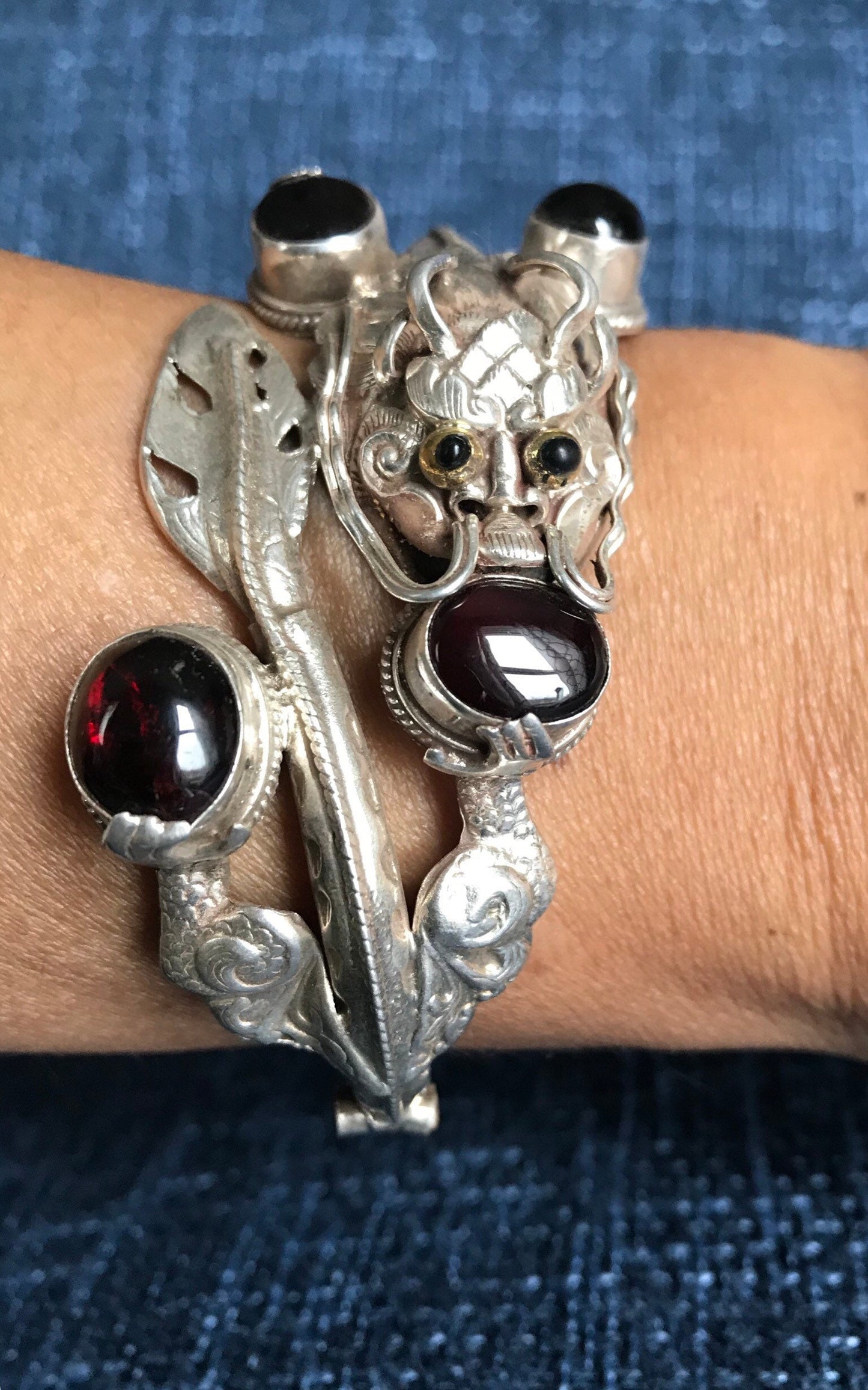 Sterling silver Dragon cuff bracelet, Handmade in Nepal, Dragon holding Garnet stone in his claws and mouth. wealth/good fortune/heroism